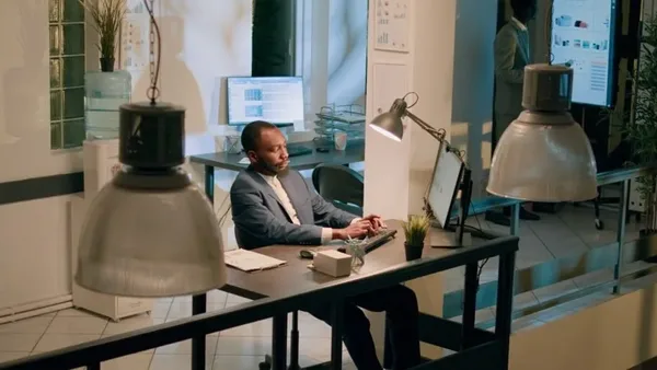 Man using a computer in a Nairobi office to organize bookkeeping tasks – Zidika Consulting, Kenya