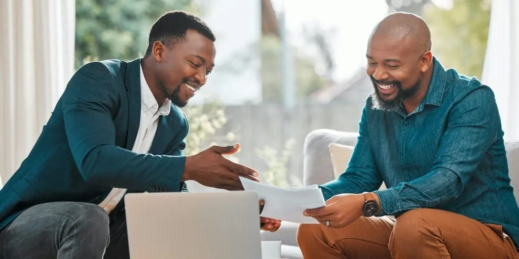 Kenyan business owners reviewing financial records for eTIMS compliance